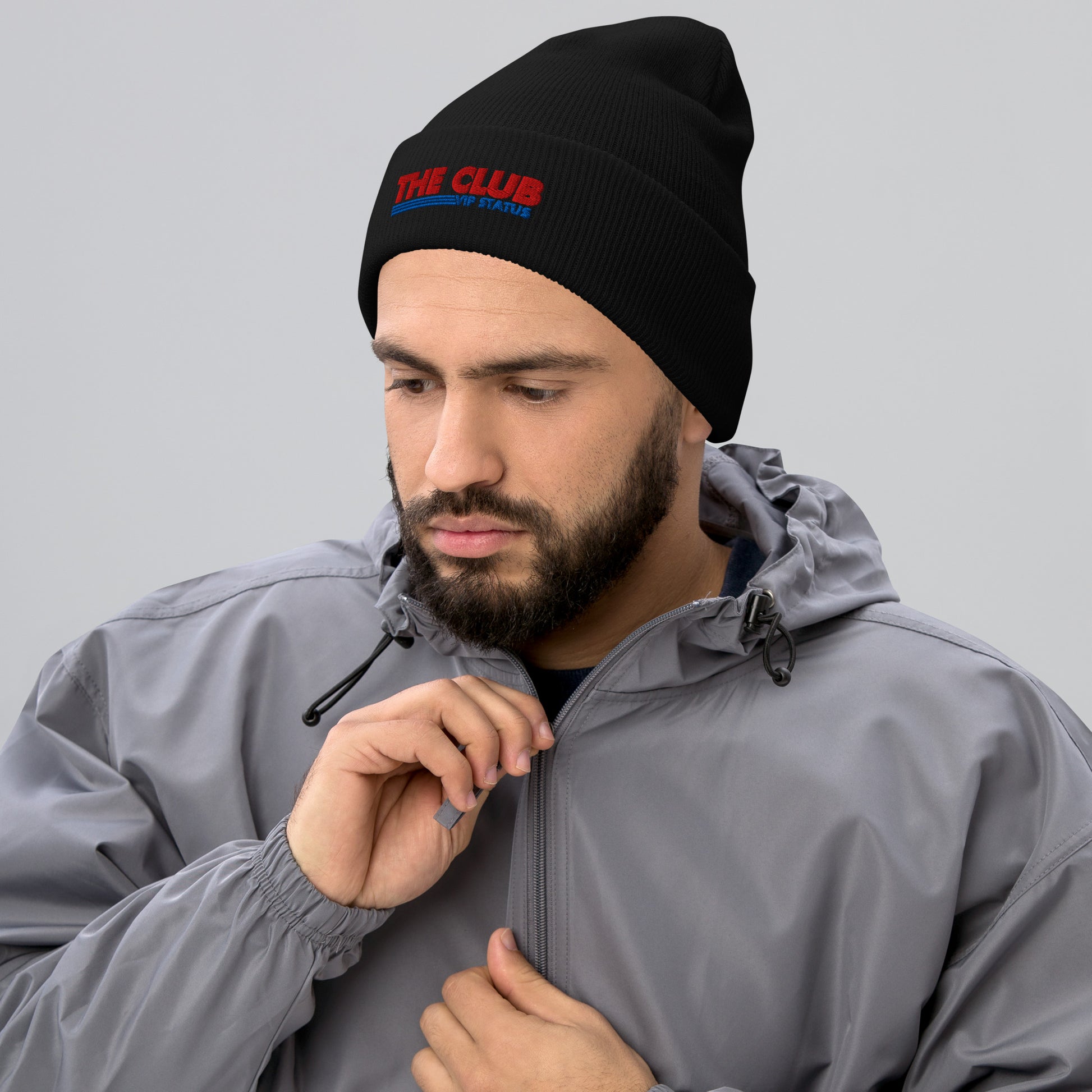 Black cuffed beanie from Say Something Swag's The Club Costco print material, shown from the front.